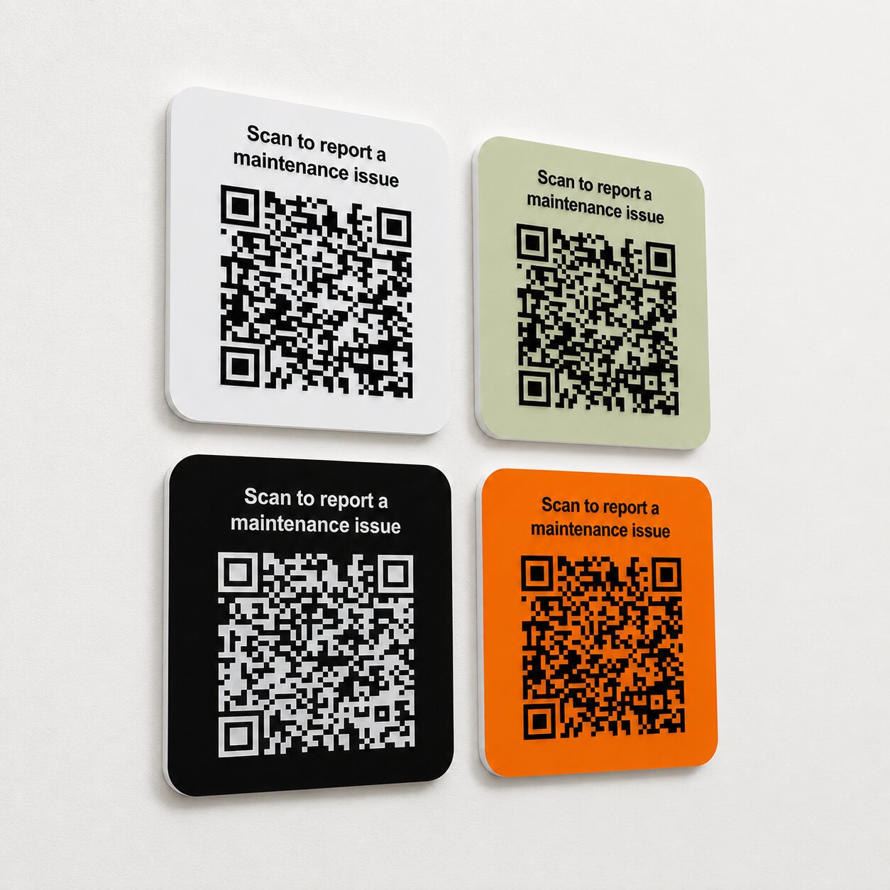 Foamex maintenance QR boards mounted on a light wall.